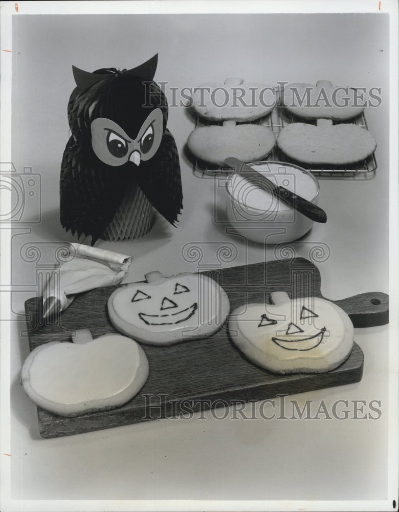 Press Photo Pictured are pumpkin shaped cookies with orange frosting. - Historic Images