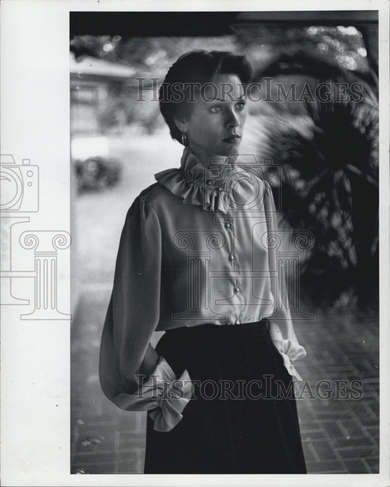 1977 Modeling a blouse - Historic Images