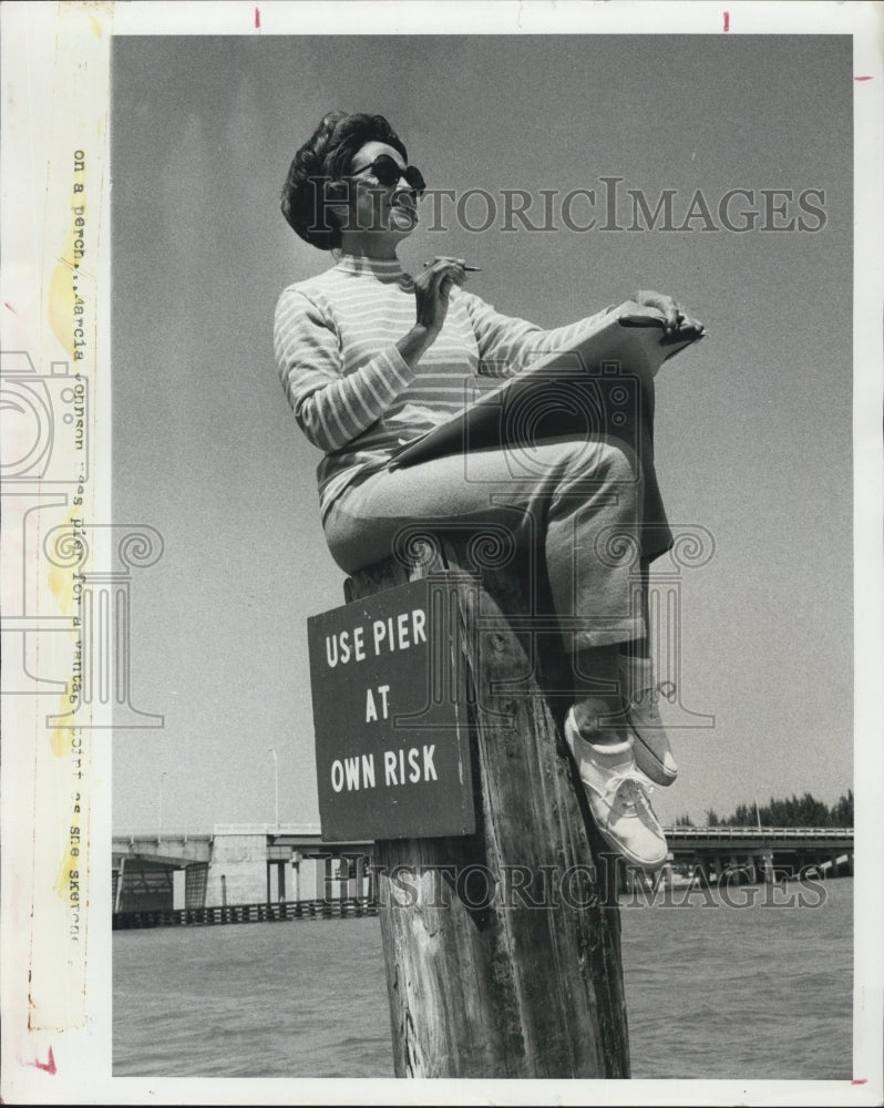 1972 Marcia Johnson sits on pier for her sketches-Historic Images