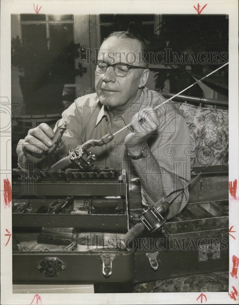 1955 Lt. Gen Pate checks his fishing gear. - Historic Images