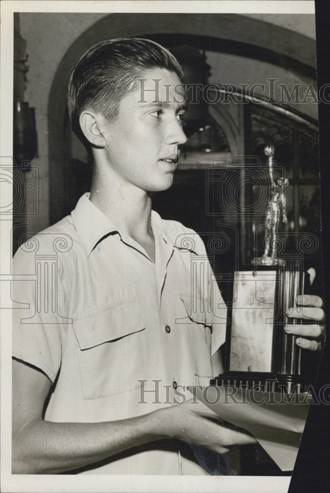 1947 Bill Stone, Captain of the basketball team, receives an award. - Historic Images