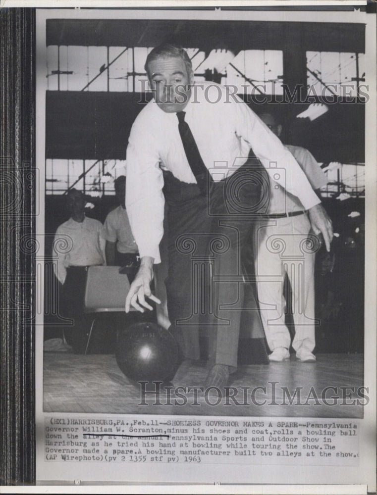 1963 Gov. William W.Scranton rolls a bowling ball. - Historic Images