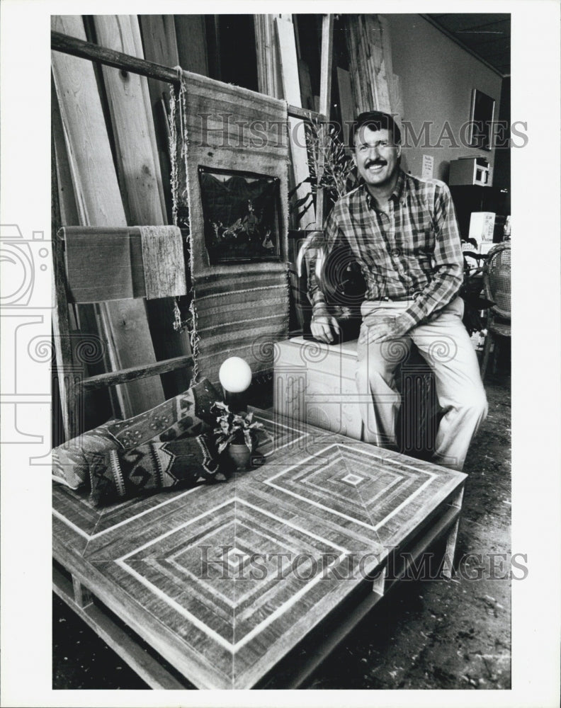 1987 Press Photo Furniture maker Kenneth Stokes stands next to a table. - Historic Images