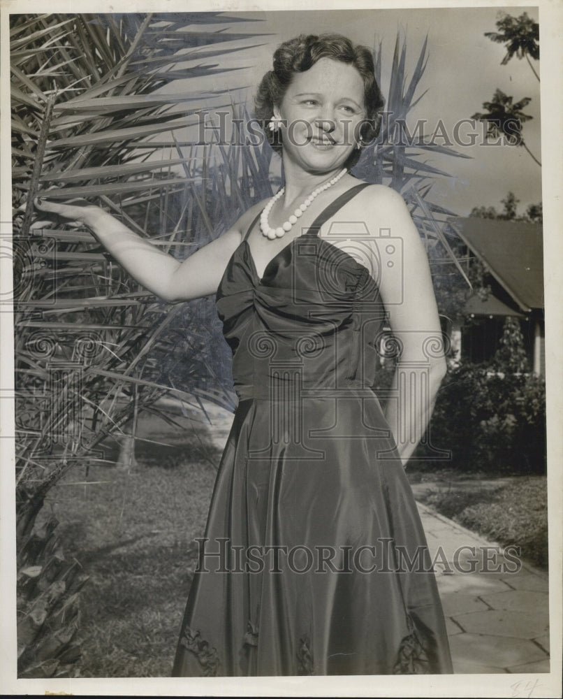 1950 Helene Wullimann
posses in the garden. - Historic Images