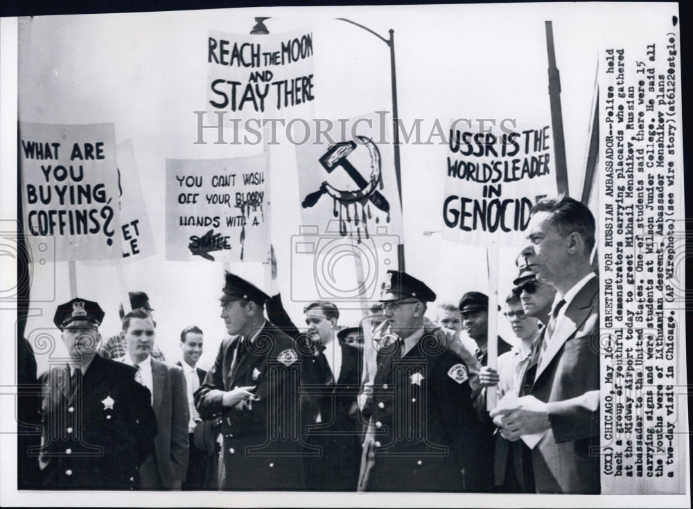 1958 Mikhail Menshikev, walking in front of protesters in Chicago. - Historic Images