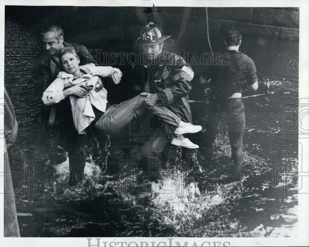 1974 Firefighters Carry Woman to Ambulance after Water Rescue - Historic Images