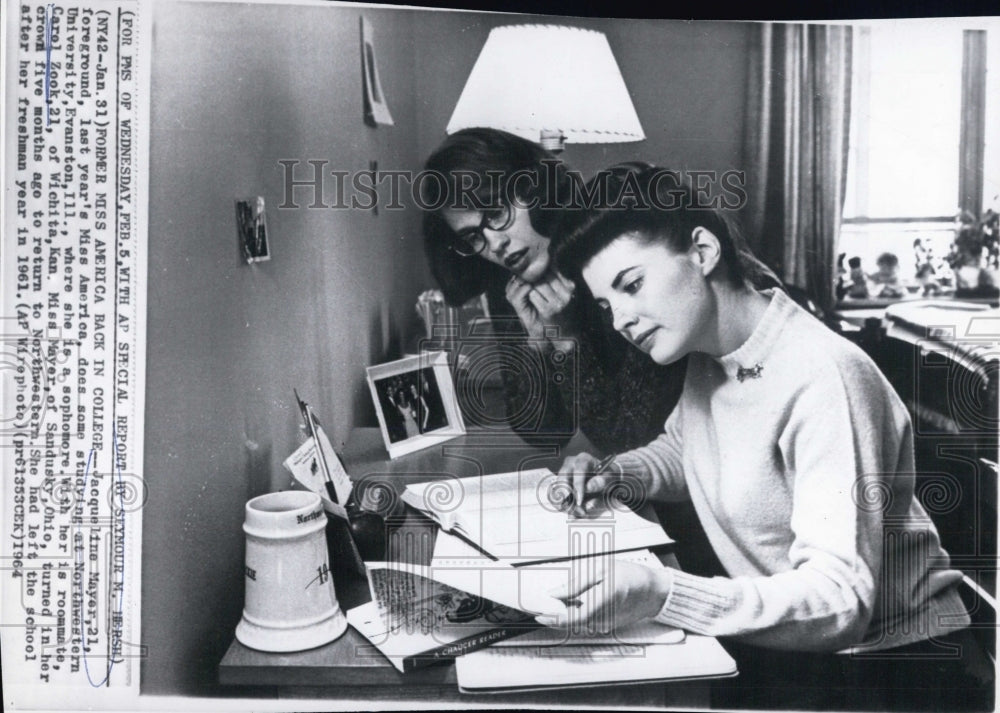 1954 A two women reading a book - Historic Images