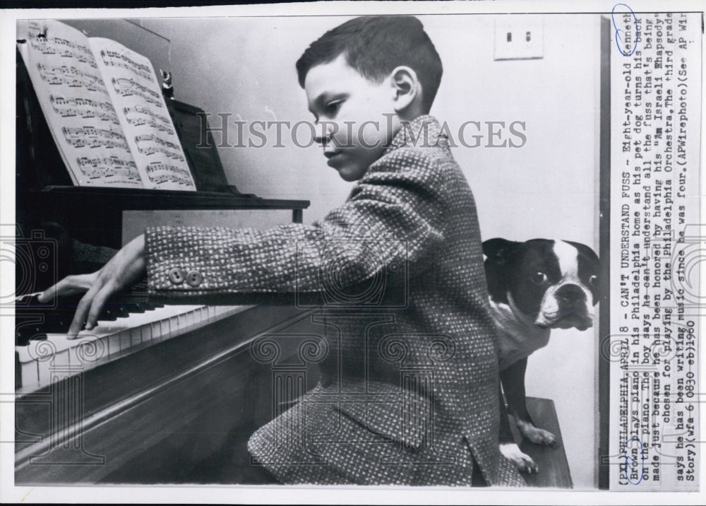 1960 8 yr old Kenneth Brown plays piano and writes music - Historic Images