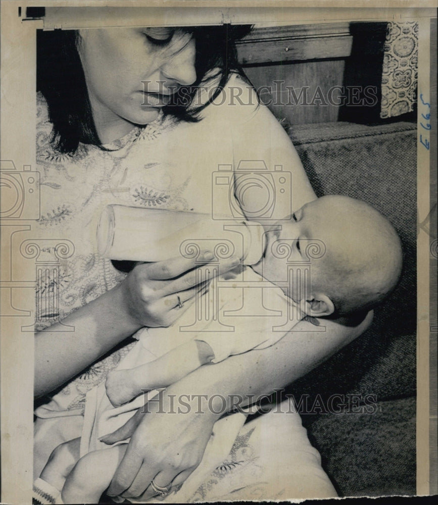 1968 Mrs. Lawrence E. Madson Jr., feeds  son donated human milk - Historic Images