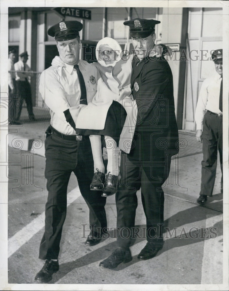 1958 Mrs. Valentina Lorente is carrier to airplane by John Cordery & - Historic Images