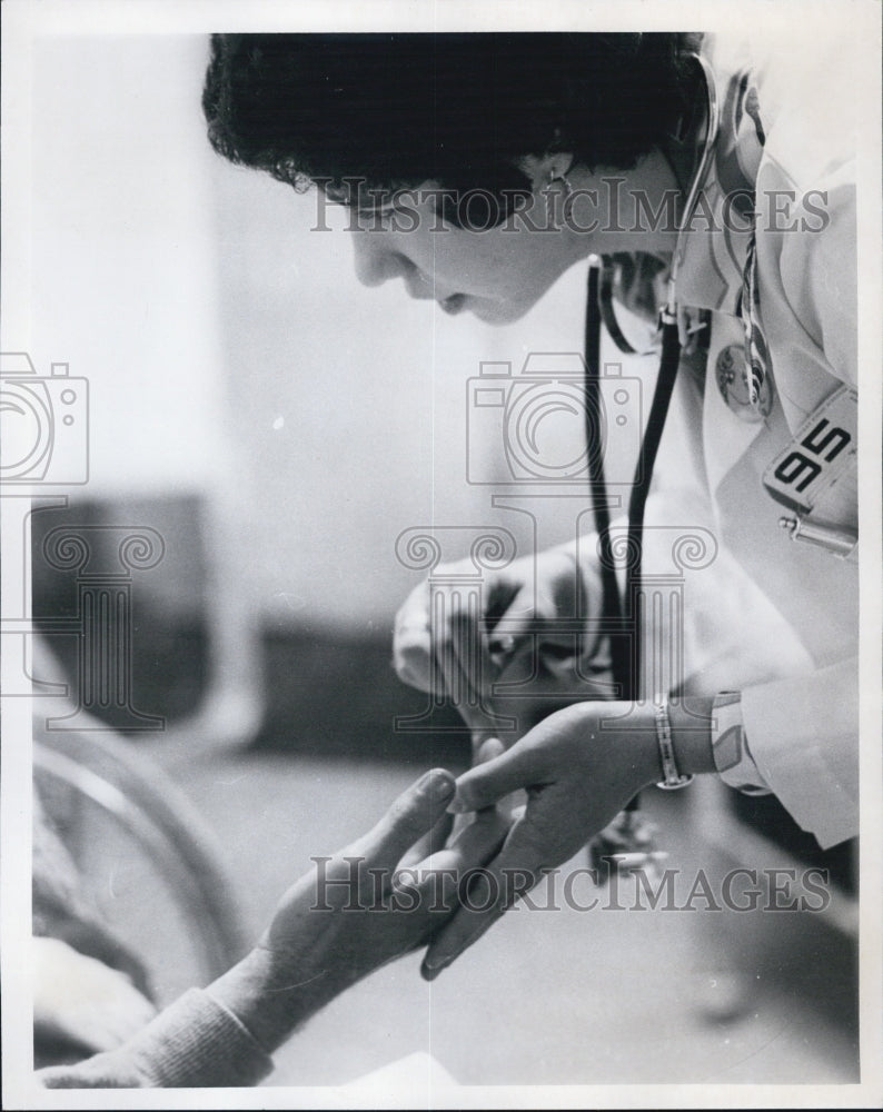 Press Photo Nerve Doctor Studies Patient - Historic Images
