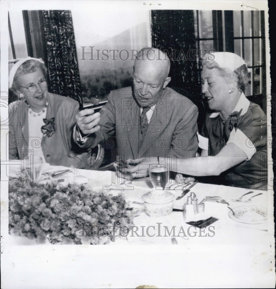 1955 President Eisenhower receives 4 leaf clover - Historic Images