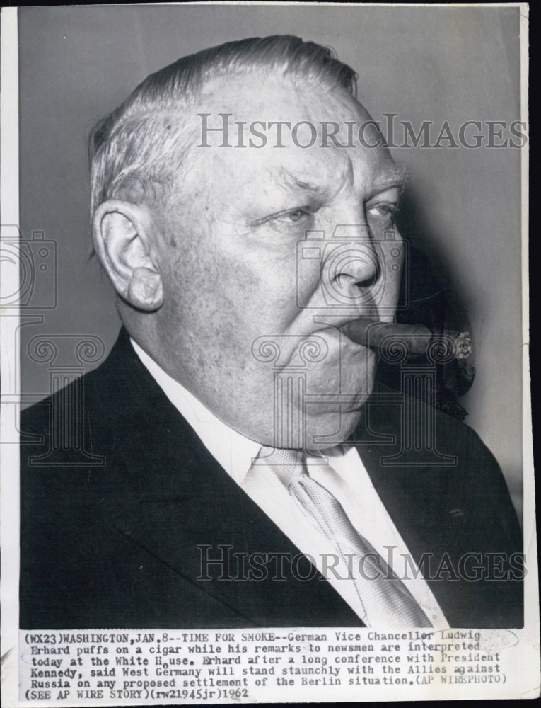 1966 Press Photo German Vice Chancellor Ludwig Erhard puffs on a cigar while his - Historic Images