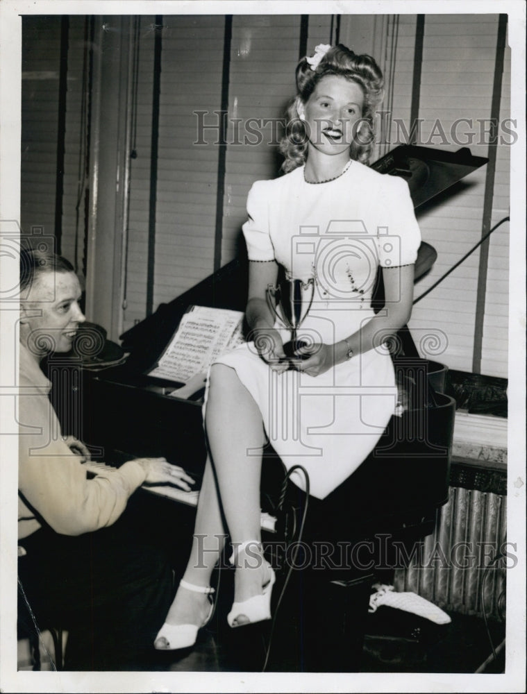 1944 Ruth Osgood holding a trophy. - Historic Images