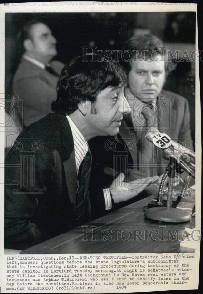 1974 Gene Demateo (L) answers questions during investigation in Hart - Historic Images