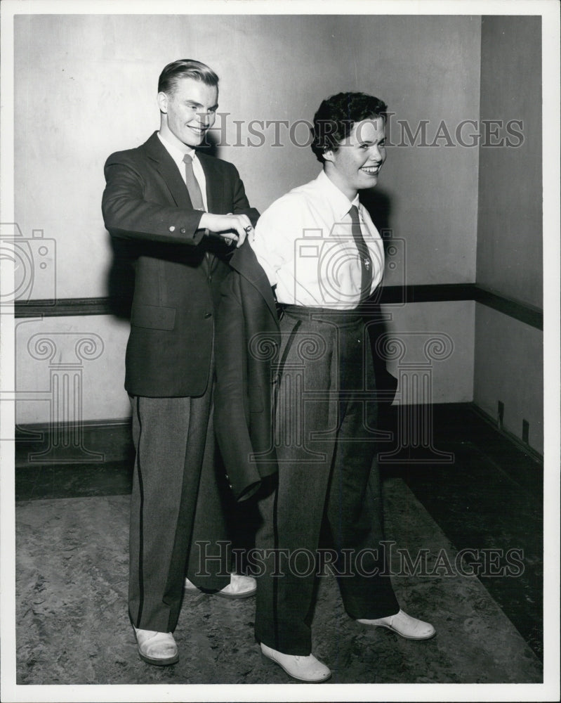 1957 Bandsman William Ericksen helps Band Sec. Phyllis Wolfson - Historic Images