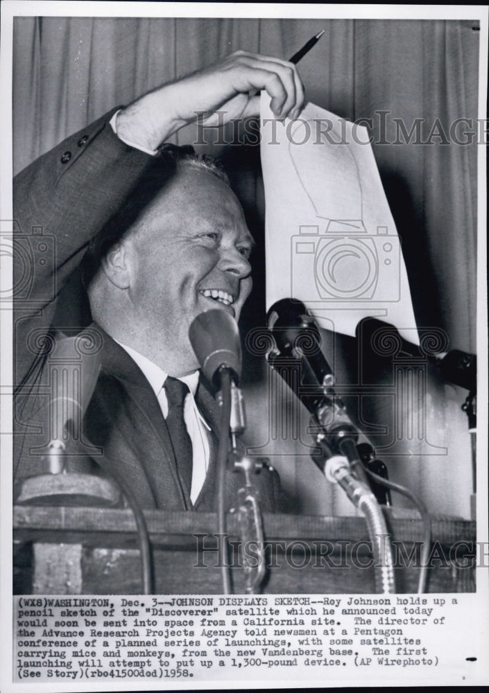 1958 Roy Johnson holds a sketch of the "Discoverer" satellite - Historic Images