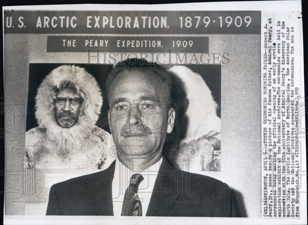 1959 Press Photo Robert Peary, Jr., poses beside a picture of his explorer fathe - Historic Images