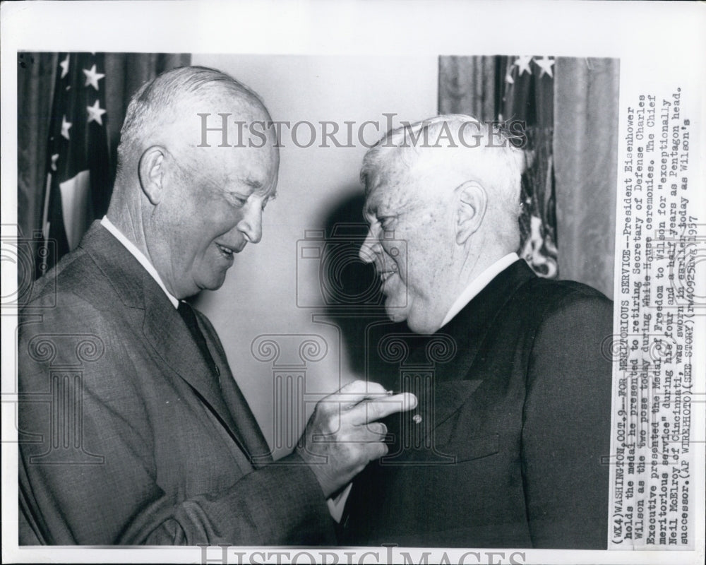 1957 President Eisenhower presents a medal to Secretary of Defense - Historic Images