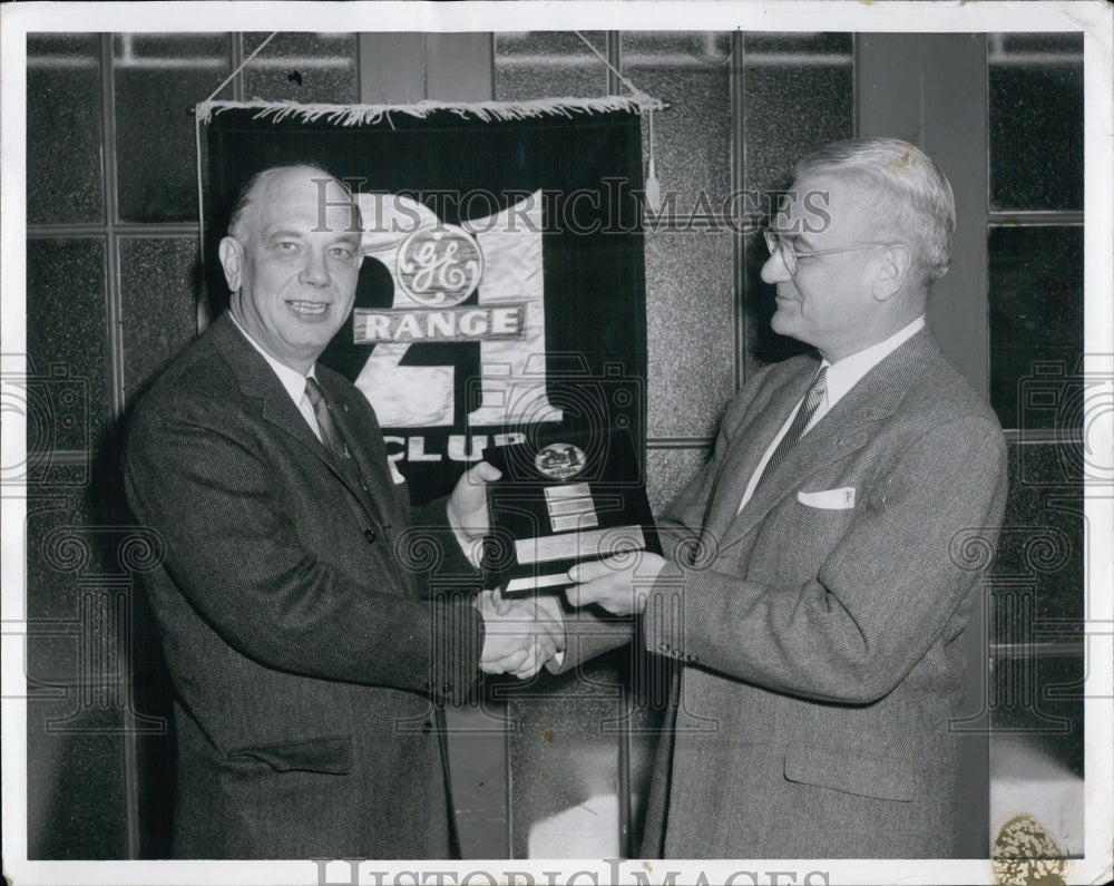 1956 C.M. Wilson(L)is happy to receive sales achievement award - Historic Images