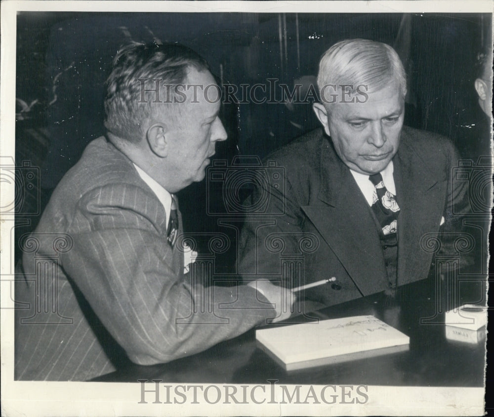 1945 C.E. Wilson (right), President of General Motors, shown with - Historic Images