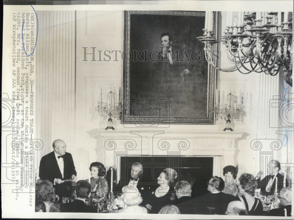 1975 British Prime Minister Harold Wilson proposes a toast during a - Historic Images