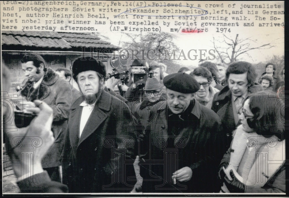 1974 followed by a crowd Alexander S(L) & Heinrich Boell - Historic Images