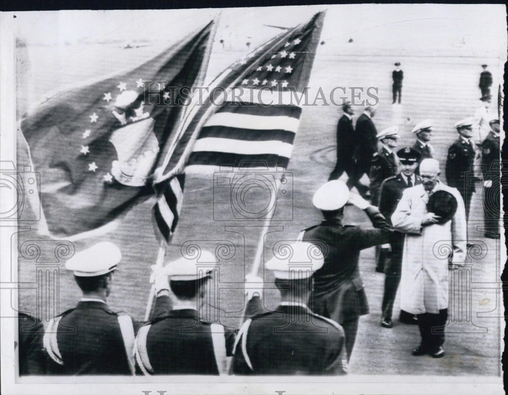 1959 Pres.Eisenhower salutes colors before boarding plane - Historic Images