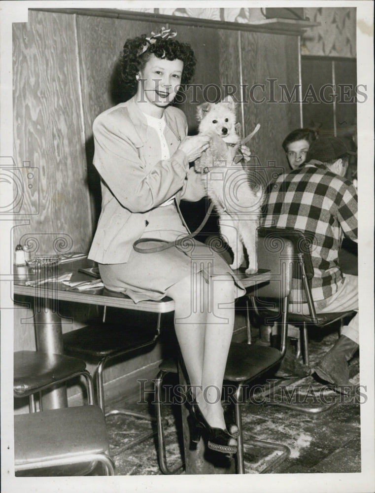 1948 Arline Butler and her dog Guppy on st Patrick's Day - Historic Images