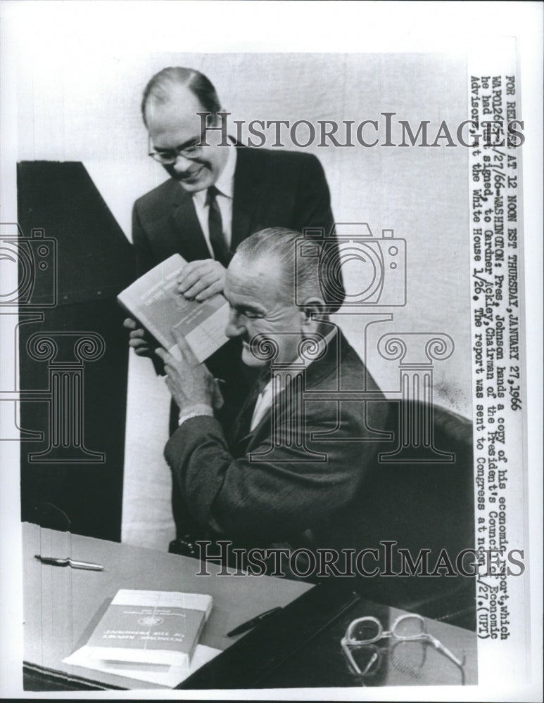 1966 Press Photo Pres. Johnson Hands Copy of His Economic Report - Historic Images