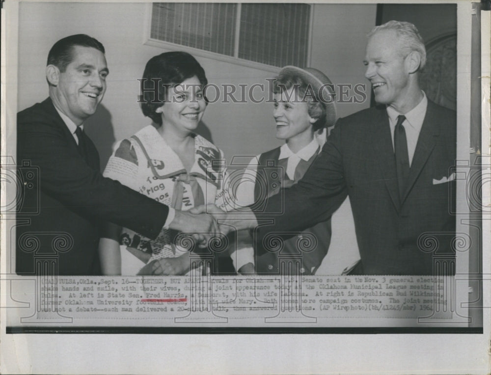 1964 Press Photo Sen.Fred Harris with his wife, Bud Wilkinam and wife shake hands and smile during a - Historic Images
