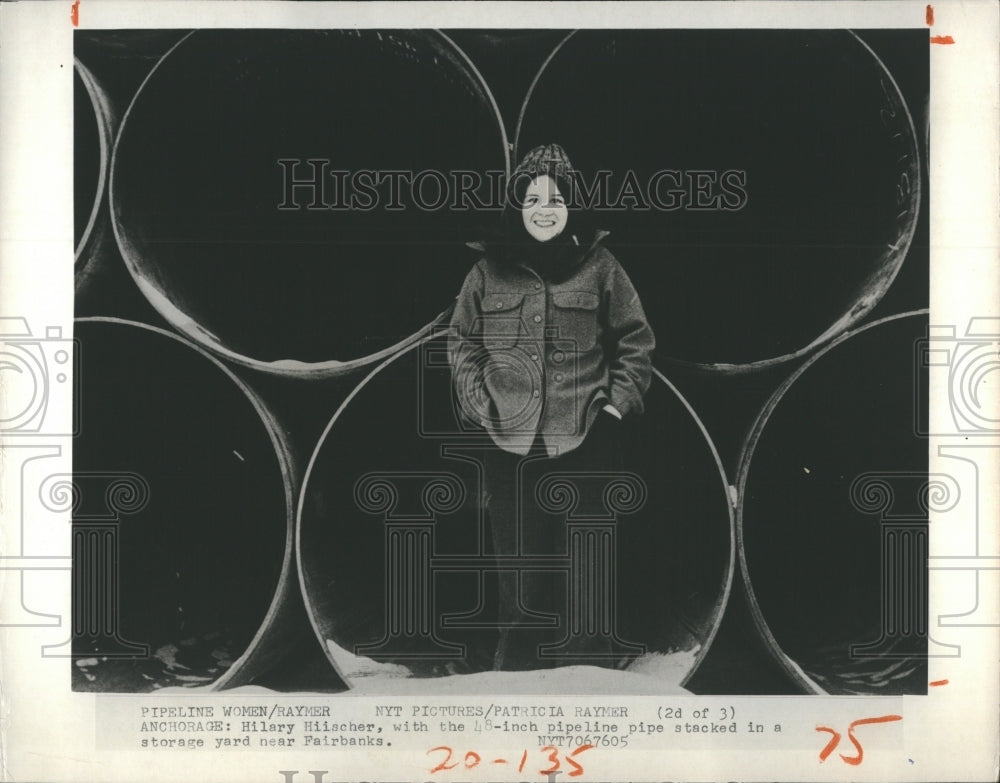 1975 Press Photo Hilary Hiischer in Front of 48 Inch Pipe for Alaskan Pipeline - Historic Images