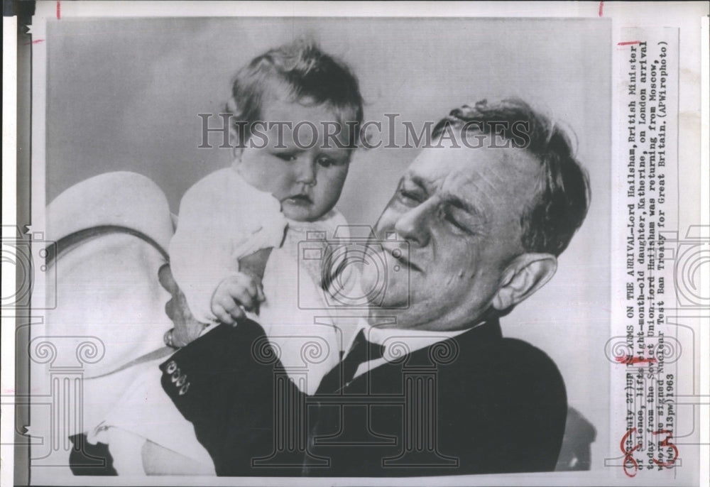 1963 Press Photo Lord Hailsham hugs his baby daughter, Katherine upon his arriva - Historic Images