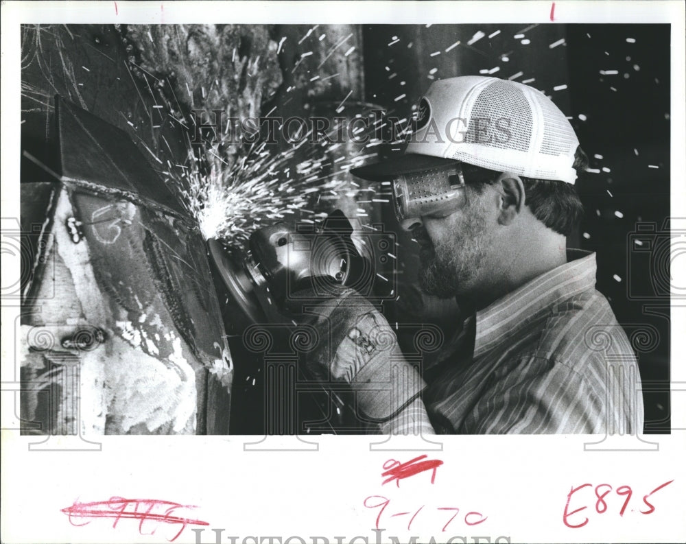 1984 Lewis wearing googles to protect his eyes from hot sparks from steel-Historic Images