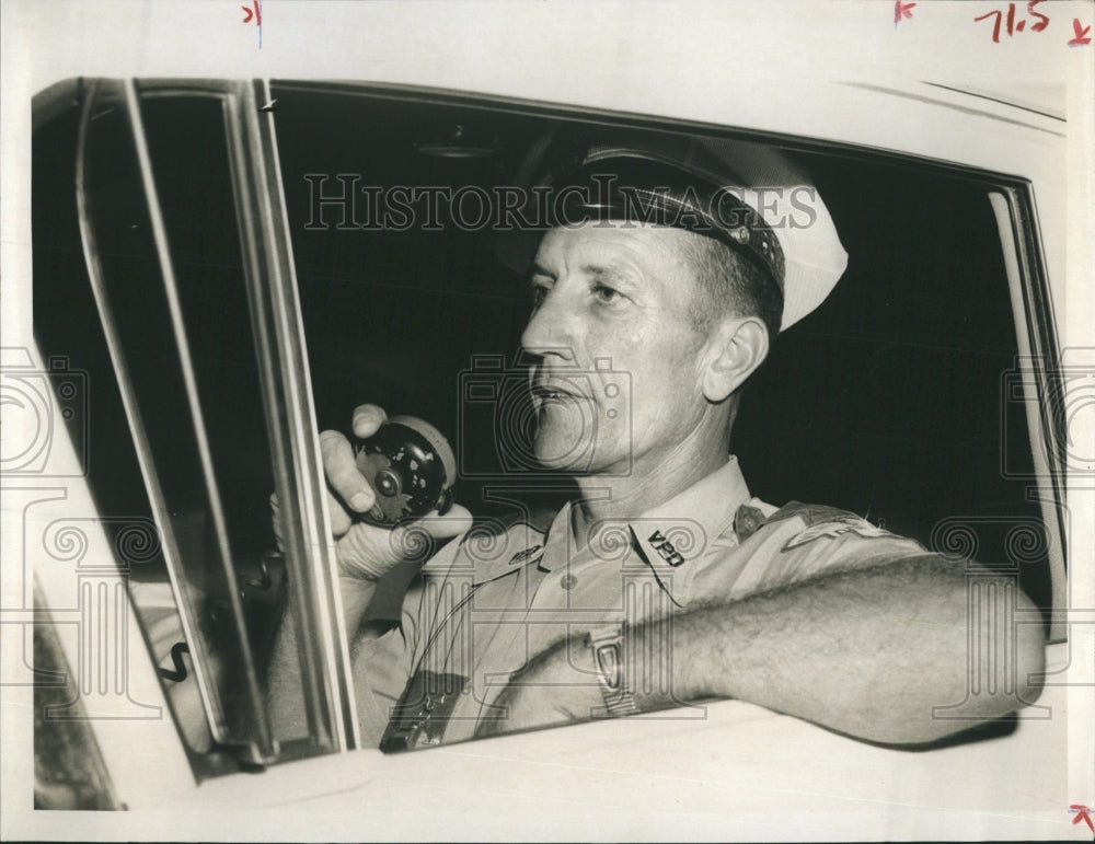 1960 Press Photo Maurice Ferguson checks with headquarters during the night duty. - Historic Images