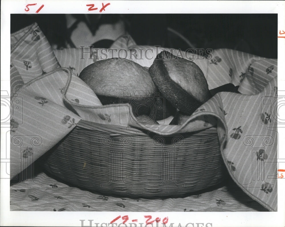 1981 Pictured is a basket of honey-orange muffins.-Historic Images