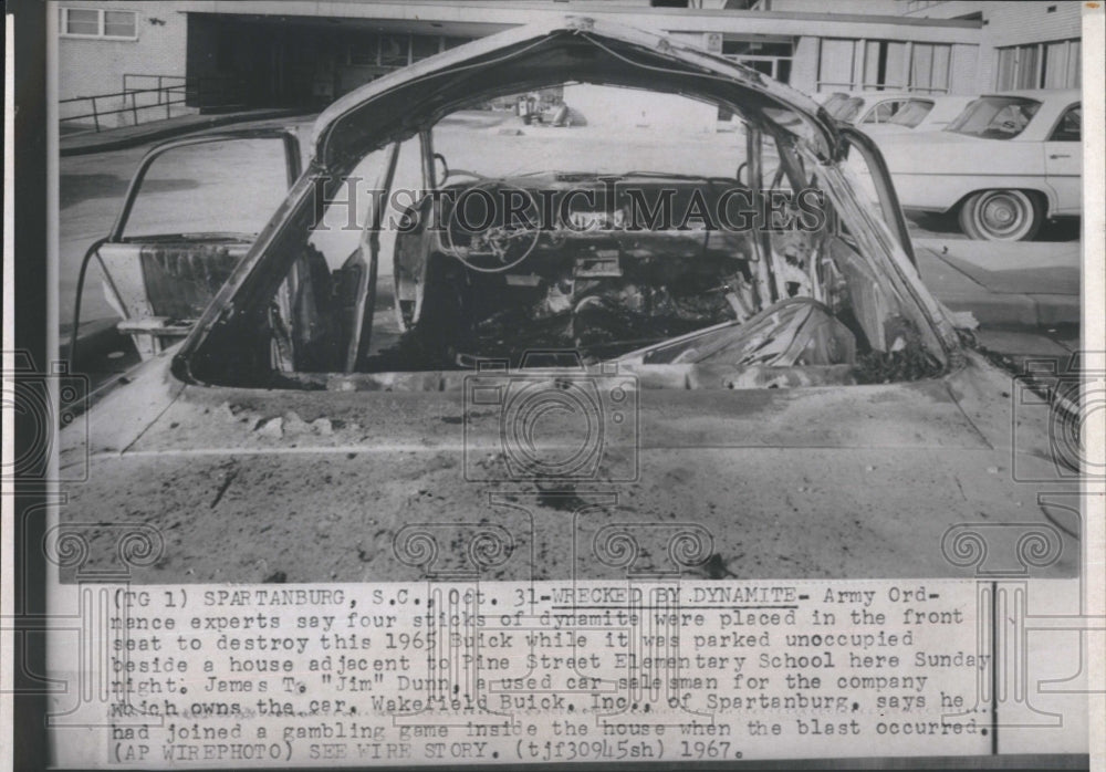 1967 Press Photo A picture of a car that has been wrecked by dynamite - Historic Images