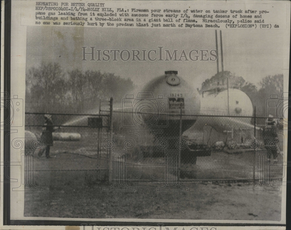 1974 Press Photo Firemen Hose Down Truck After Explosion - RSH15741 - Historic Images