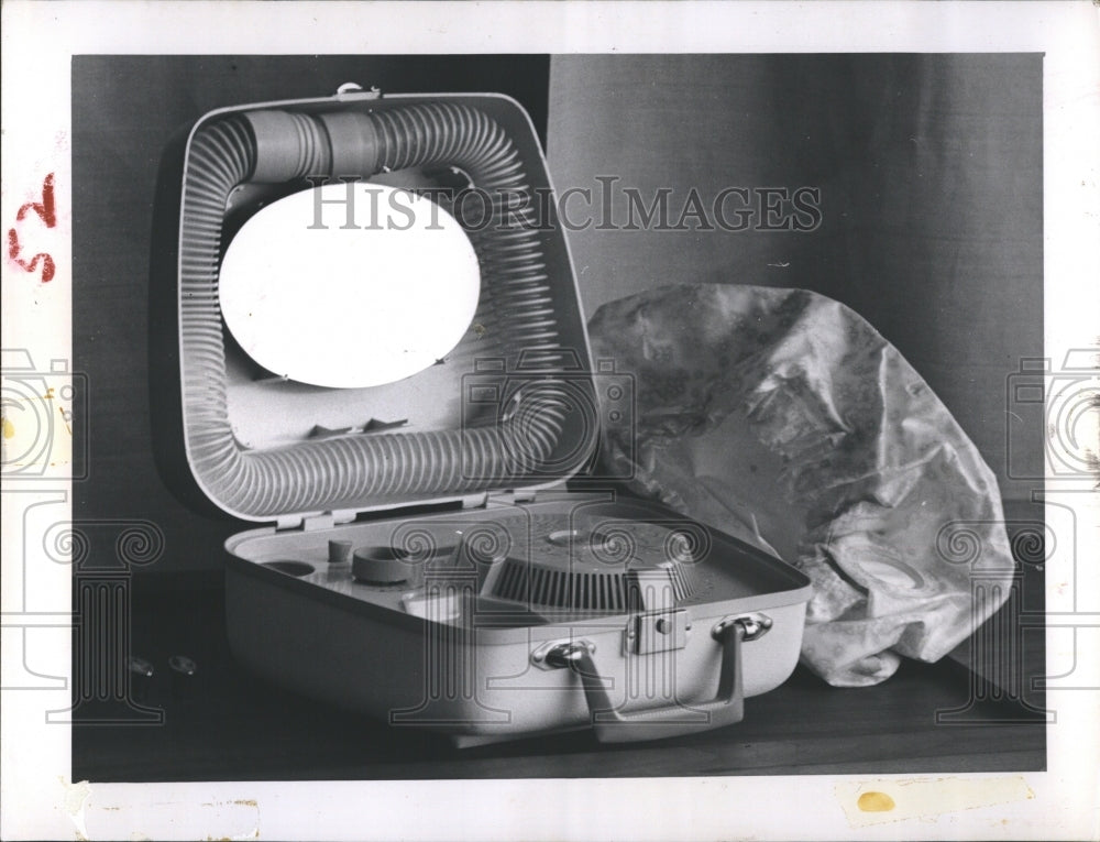 Press Photo Pictured is a hair dryer. - Historic Images