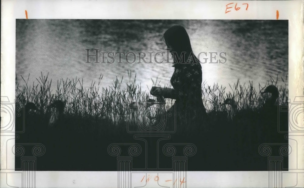 1974 Press Photo Girl Sits By Creek Bank - Historic Images