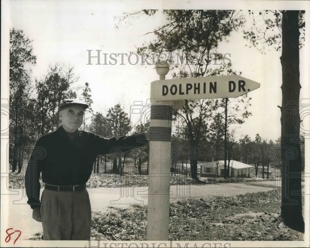 1965 Press Photo Fred G. Manuel standing next to a signpost - RSH20555 - Historic Images