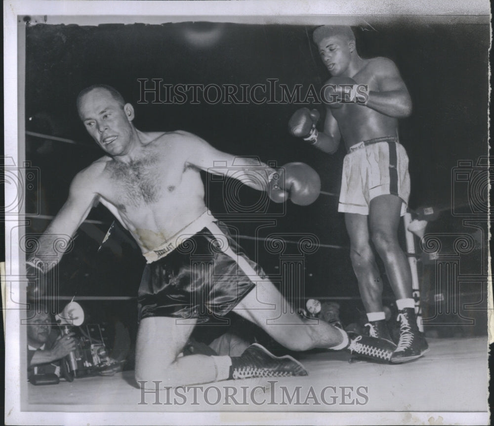 1957 Press Photo Pete Rademacher knocked down by Floyd Patterson - Historic Images