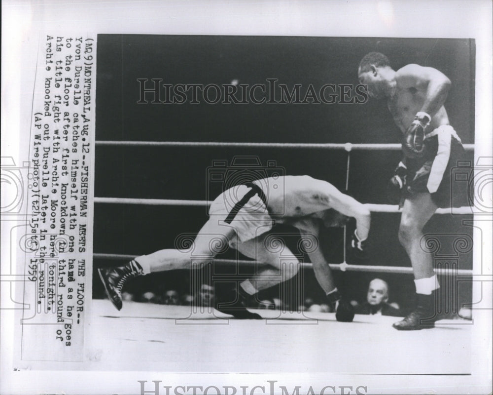 1959 Press Photo Yvon Durelle fights Archie Moore. - Historic Images