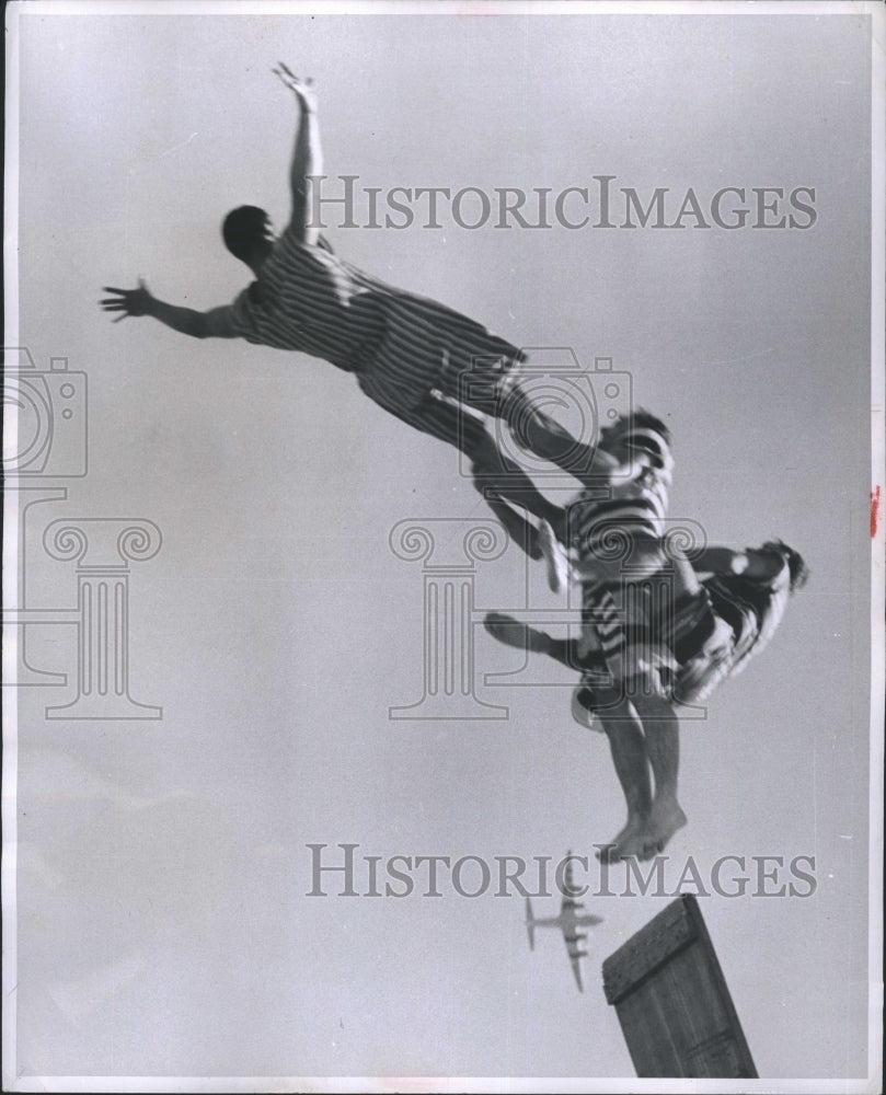 1956 Trio of acrobats   and an airplane.-Historic Images