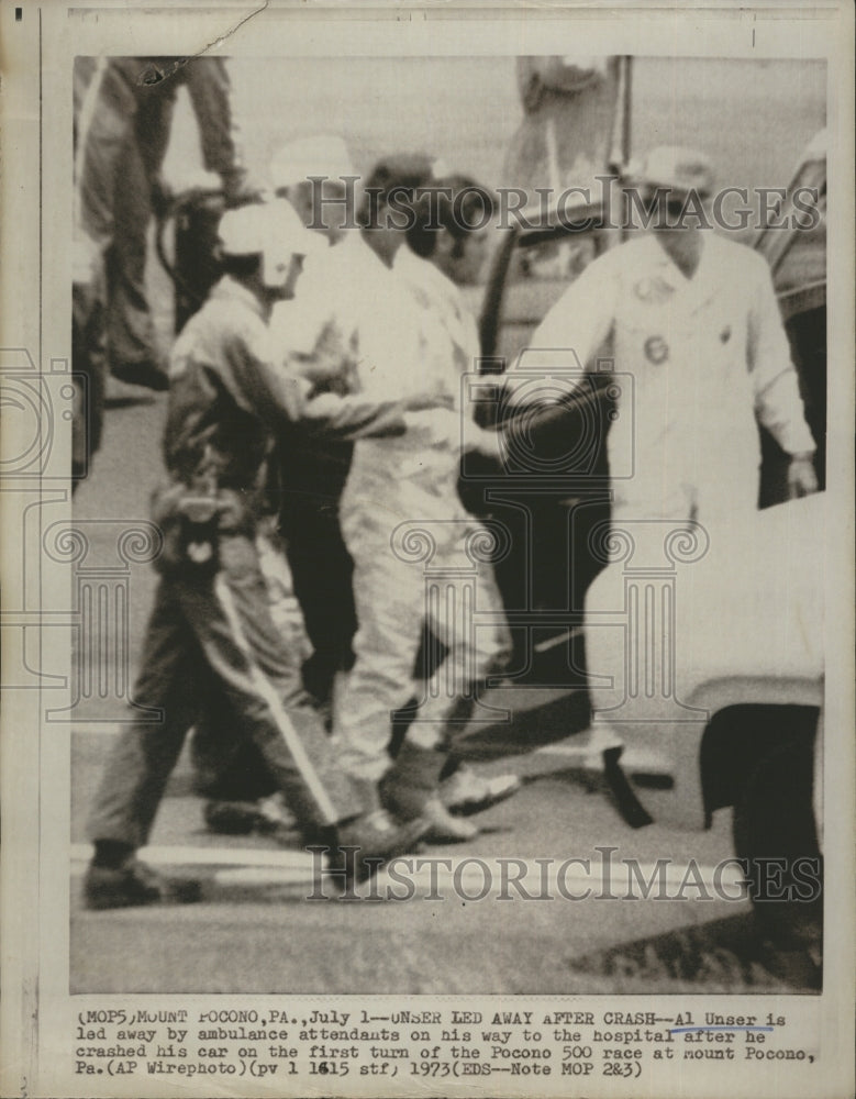 1973 Press Photo Al Unser on his way to the hospital after crashing his car at - Historic Images