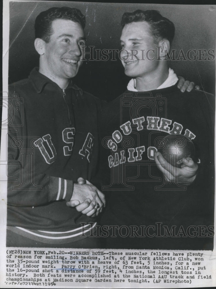 1954 Athletes Bob Backus (L) and Parry O' Brien at the AAU meet - Historic Images