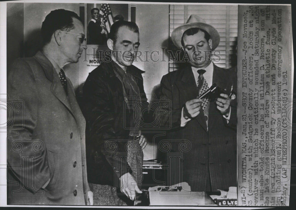 1951 Press Photo Joe Novacek looks at .38 revolver used in shooting - Historic Images