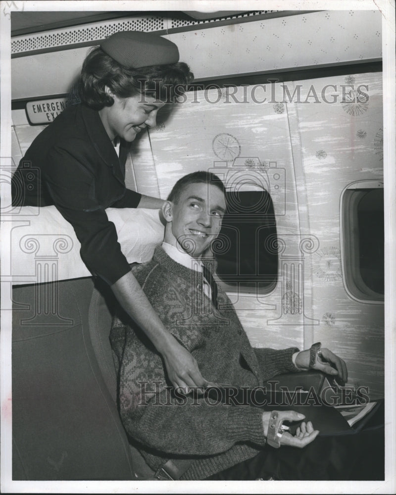 1964 Press Photo Two people pose on an airline. - RSH30837 - Historic Images