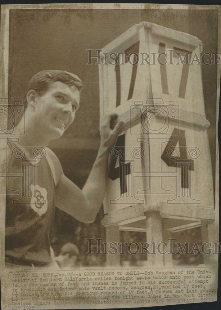 1968 Press Photo Bob Seagren USC Smiles Holds Post Number of Feet Inches Jumped - Historic Images