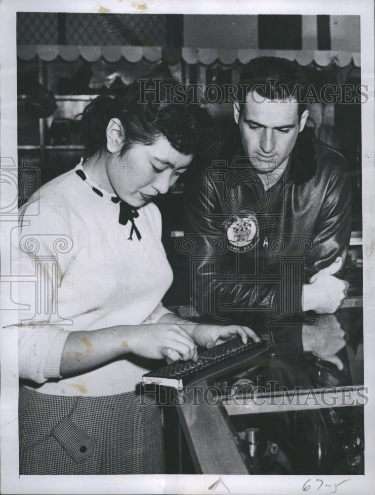 1953 Press Photo New York Yankees Star, Capt. Jerry Coleman watches a maid. - Historic Images